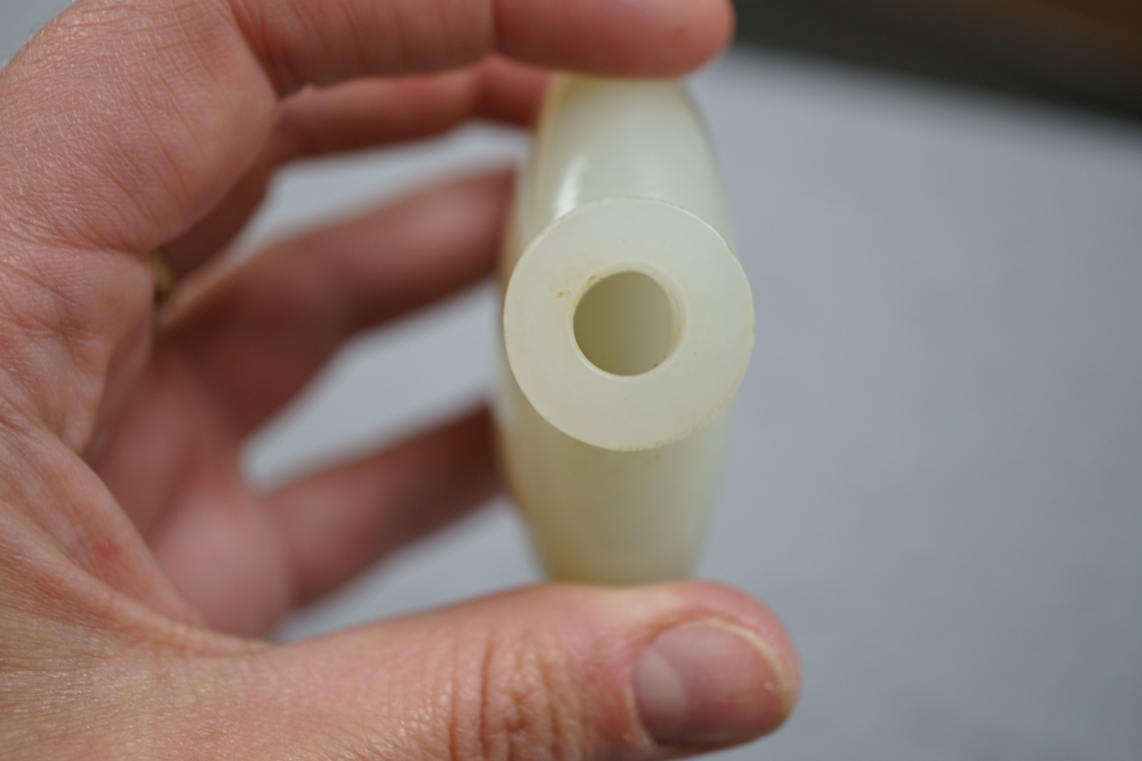 A Chinese pale celadon jade snuff bottle, of moonflask form, 19th century
